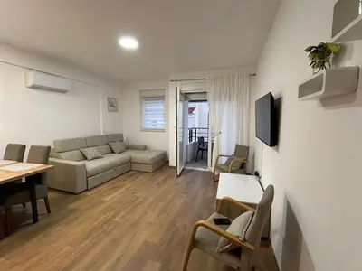 a living room with a couch and a table at Appartement entièrement équipé neuf Budva - Appart 8 in Budva