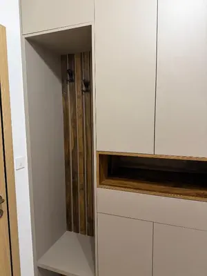 a white cupboard with a tv inside of it at Montenegro Luxury Suites - New City Podgorica in Podgorica