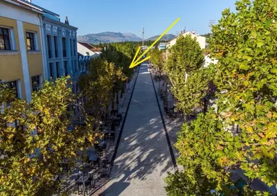 an overhead view of a street with trees and buildings at Apartment 081 City Center in Podgorica