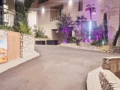 an empty street in front of a building at Studio Apartment Ljilja in Budva