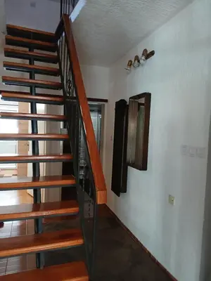 a wooden staircase in a room with a window at Apartment Icemoon in Kotor
