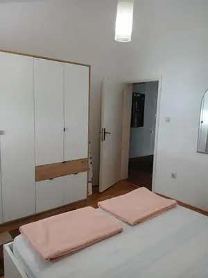 two towels are sitting on a bed in a room at Apartment Icemoon in Kotor