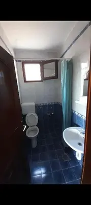 a bathroom with a toilet and a sink at Šušanj dvokrevetna soba in Bar, Susanj