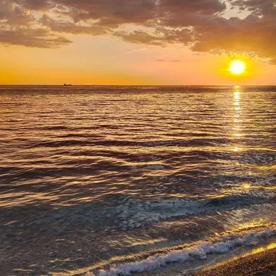 a sunset over the ocean with the sun setting at Apartmani Kolovic Susanj in Bar