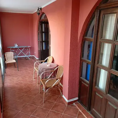 a room with a table and chairs and a table at Apartmani Kolovic Susanj in Bar