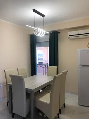 a dining room with a table and chairs at BonMare.apt4 in Dobra Voda