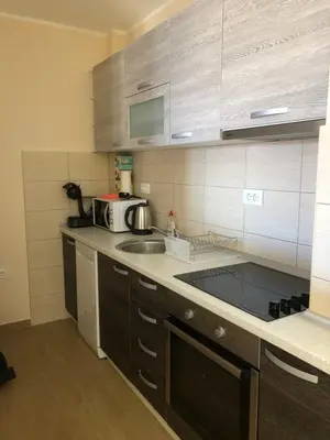 a kitchen with a sink and a microwave at BonMare.apt4 in Dobra Voda