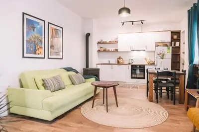a living room with a couch and a table at Casa Hollaj in Vladimir