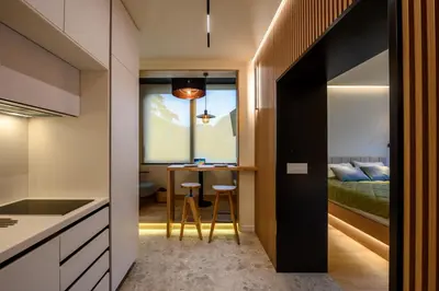 a room with a kitchen and a bedroom at Modular Sea view Spa Studio in Kotor