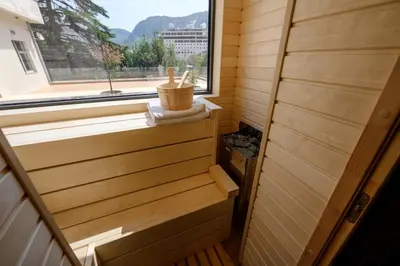 a sauna with a window and a towel at Modular Sea view Spa Studio in Kotor
