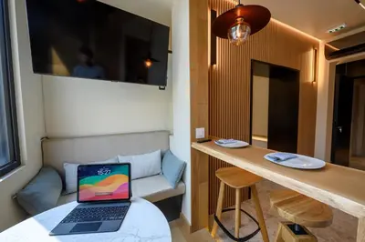 a small room with a laptop on a table at Modular Sea view Spa Studio in Kotor
