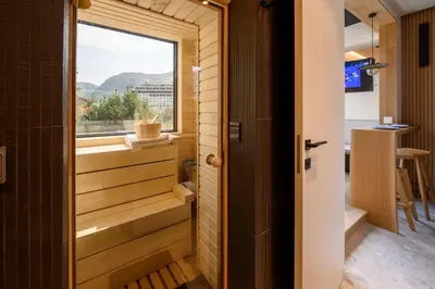 a view from the door of a tiny house with a window at Modular Sea view Spa Studio in Kotor