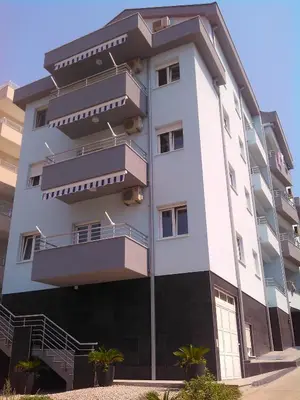 a building with balconies on the side of it at Apartments Becici in Budva