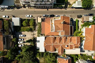 an overhead view of a brick building with cars at Villa Velzon Guesthouse in Budva