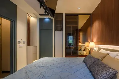 a bedroom with a large bed and a kitchen at Modular Central Studio in Kotor