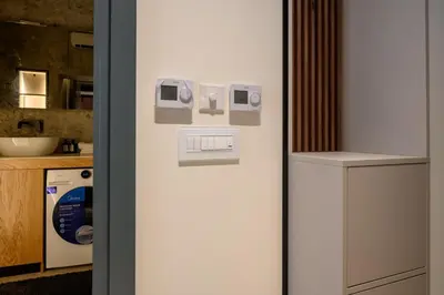 a white refrigerator in a kitchen next to a counter at Modular Central Studio in Kotor