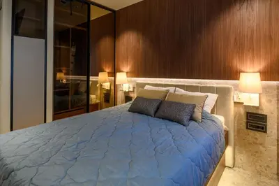 a bedroom with a large blue bed with two pillows at Modular Central Studio in Kotor