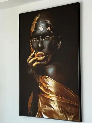 a framed picture of a gold statue at Sisters residence in Kotor