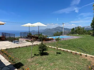 a house with a pool and a view of the ocean at Old House Poda in Rap