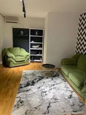 a living room with a couch and a rug at Njaro del mar 16 in Petrovac na Moru