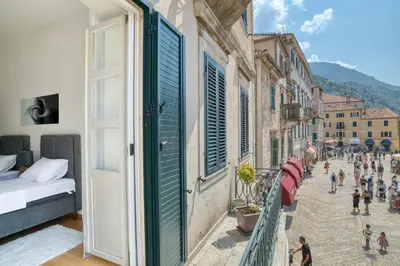 a group of people walking down a street at Luxury Main Square apartment by MN Property in Kotor