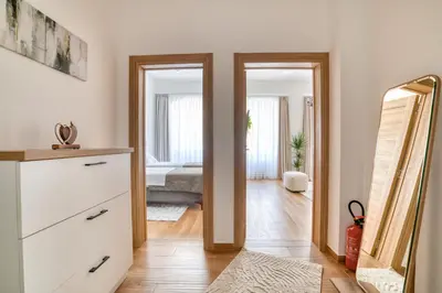 a room with a mirror and a dresser and a bedroom at Luxury Main Square apartment by MN Property in Kotor