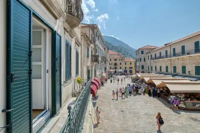 a group of people walking down a street at Luxury Main Square apartment by MN Property in Kotor