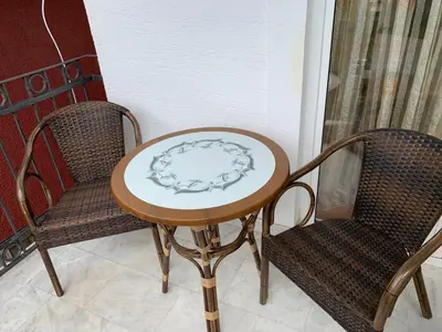 a table and two chairs with a plate on it at Njaro del mar 3 in Petrovac na Moru