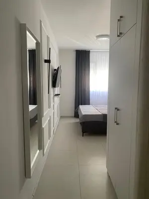 a small room with a bed and a window at Central Terminal Podgorica in Podgorica