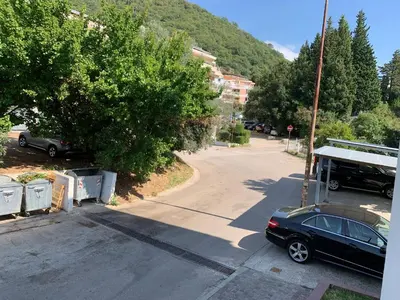 a car parked on the side of a street at Njaro del mar 1 in Petrovac na Moru