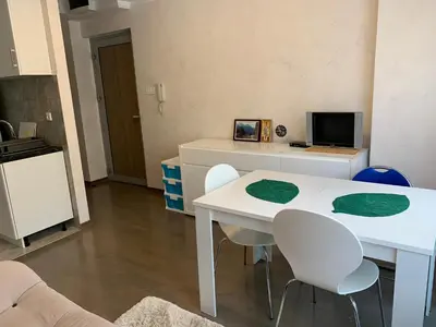 a living room with a white table and chairs at Njaro del mar 1 in Petrovac na Moru