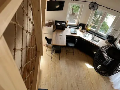 an overhead view of a kitchen with a desk and chairs at M&M Apartments in Kotor