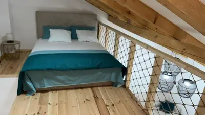 a bedroom with a bed in a attic at M&M Apartments in Kotor