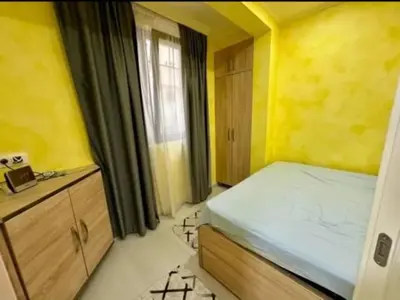 a small bedroom with a bed and a window at Šušanj Bar in Bar, Susanj
