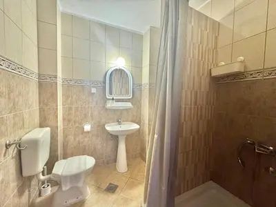 a bathroom with a toilet and a sink and a shower at Calma Vista Apartments by Vila Vanja in Budva