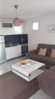 a living room with a couch and a coffee table at Utjeha Montenegro in Masline