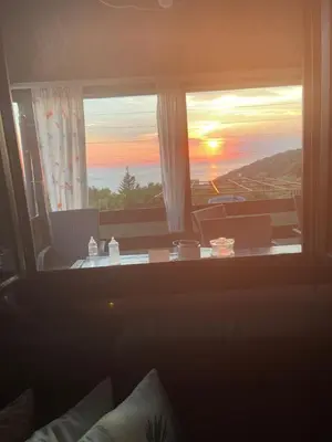 a room with a window with a view of the sunset at Utjeha Montenegro in Masline
