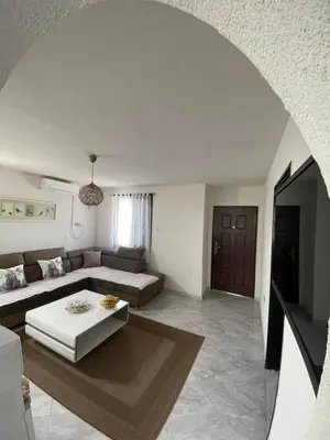 a living room with a couch and a table at Utjeha Montenegro in Masline