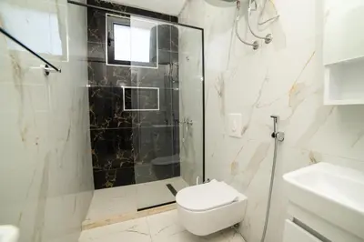 a bathroom with a shower and a toilet and a sink at You GO in Velika Plaža
