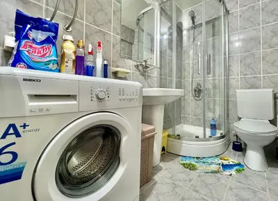 a bathroom with a washing machine and a toilet at Homestay LGBT friendly - DOUBLE BED ROOM in Budva