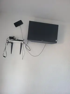 a flat screen tv hanging on a wall at Apartment Asko in Ulcinj