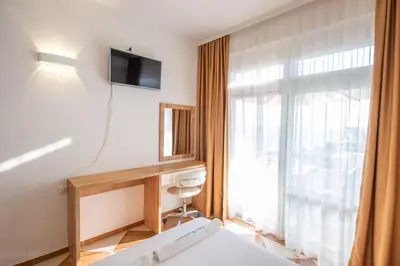 a hotel room with a bed and a window at Lana Apartments Nr 11 in Ulcinj