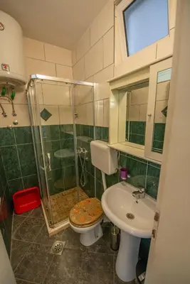 a bathroom with a shower and a toilet and a sink at Lana Apartments Nr 11 in Ulcinj