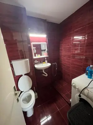 a bathroom with a toilet and a sink at Garsonjera Ulcinj in Ulcinj