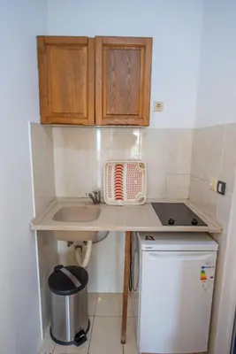 a small kitchen with a sink and a counter at Lana Apartments Nr 3 in Ulcinj