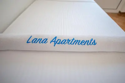 a mattress with the word lanana appointments written on it at Lana Apartments Nr 3 in Ulcinj