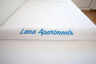 a white mattress with the word lane appointments on it at Lana Apartments Nr 2 in Ulcinj