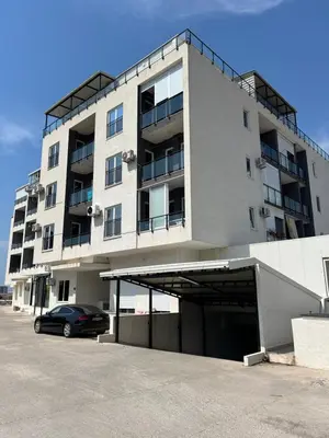 a building with a car parked in front of it at Apartment Aleksa in Bar
