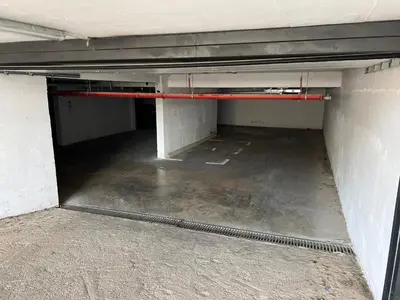 an empty garage with a red hose in it at Apartment Aleksa in Bar