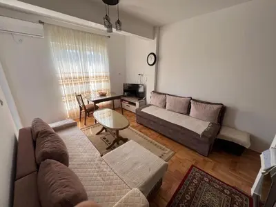 a living room with a couch and a table at Apartment Aleksa in Bar